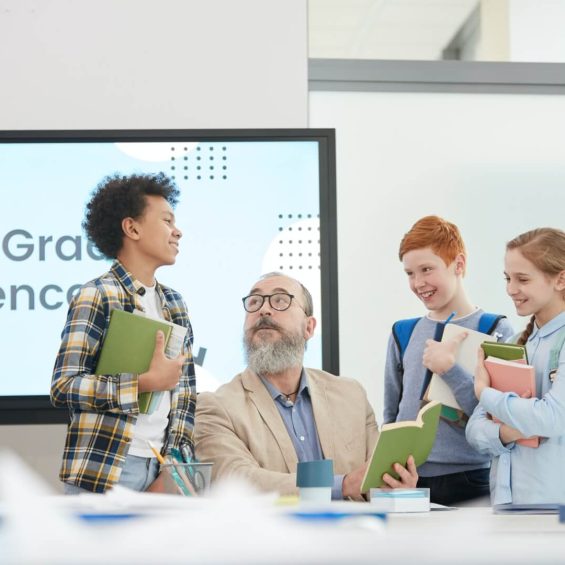 group-of-kids-talking-to-teacher-in-school.jpg group-of-kids-talking-to-teacher-in-school.jpg
